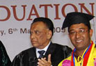 A Student Receiving his degree at the Convacation alongwith family
