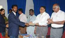 Secretary presents an award to a student